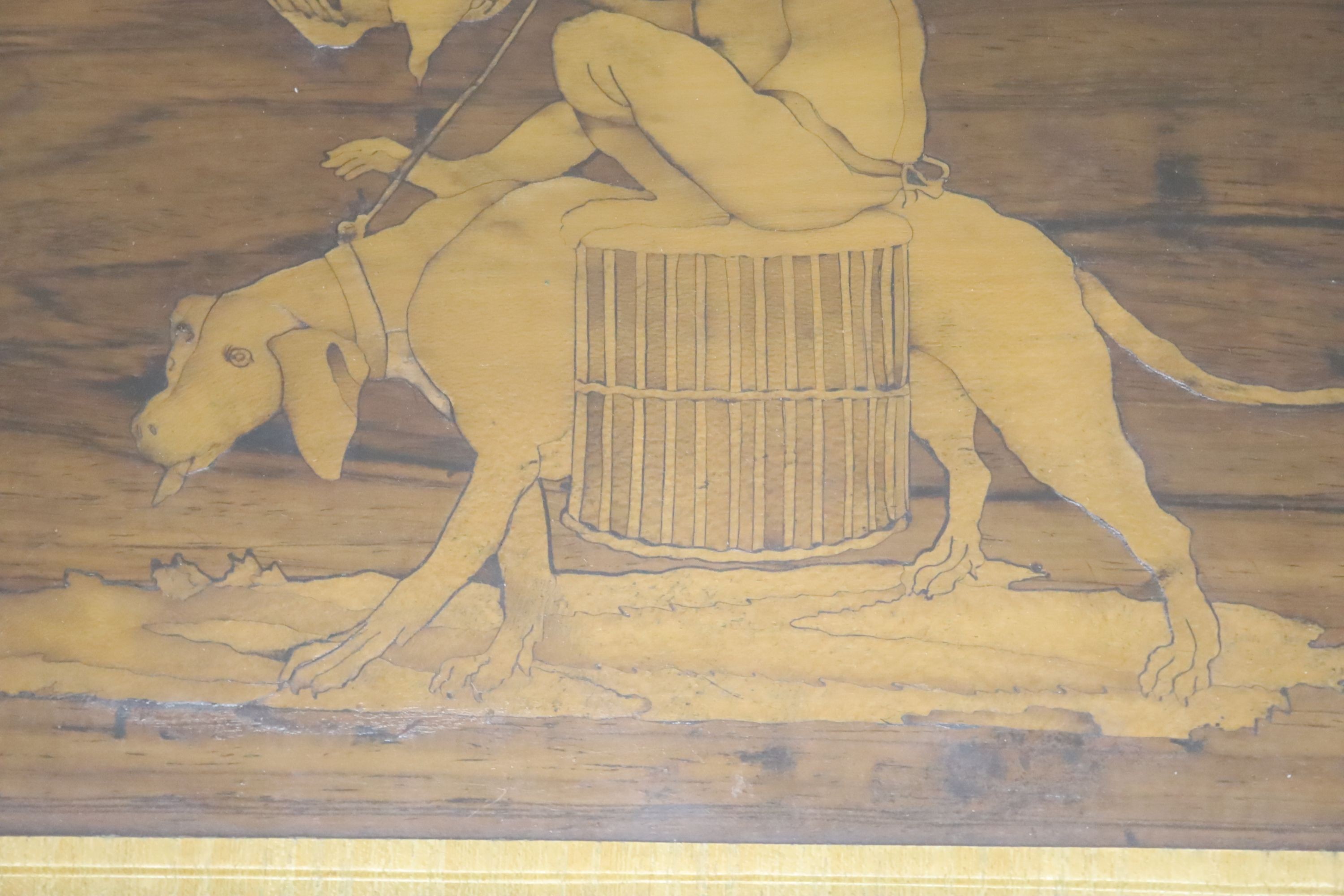 An Italian reversible marquetry picture of a monkey riding a hound, width 28cm